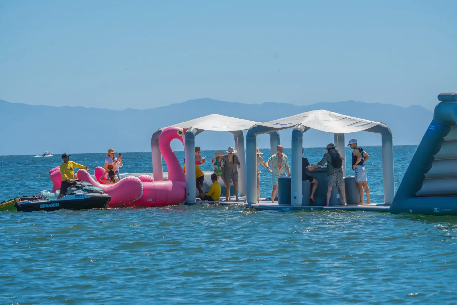 Family enjoying inflatable Pop Up Park – Surf Mexico Adventure on inflatable pop up park in Riviera Nayarit